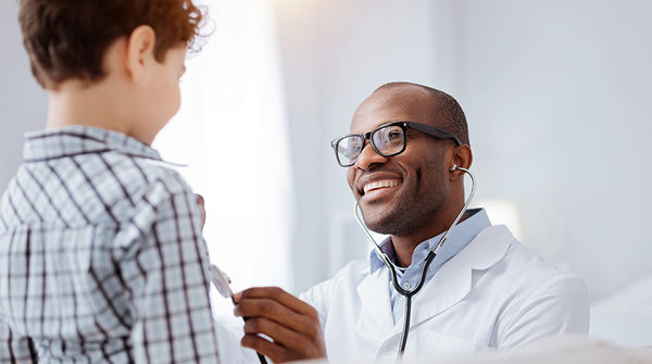 happy child with male doctor